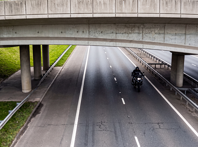 Motorcylist riding adv motorcycle on commute